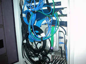Tovegin's Network "Room" w/ patch cabinet open (Click for larger image.)